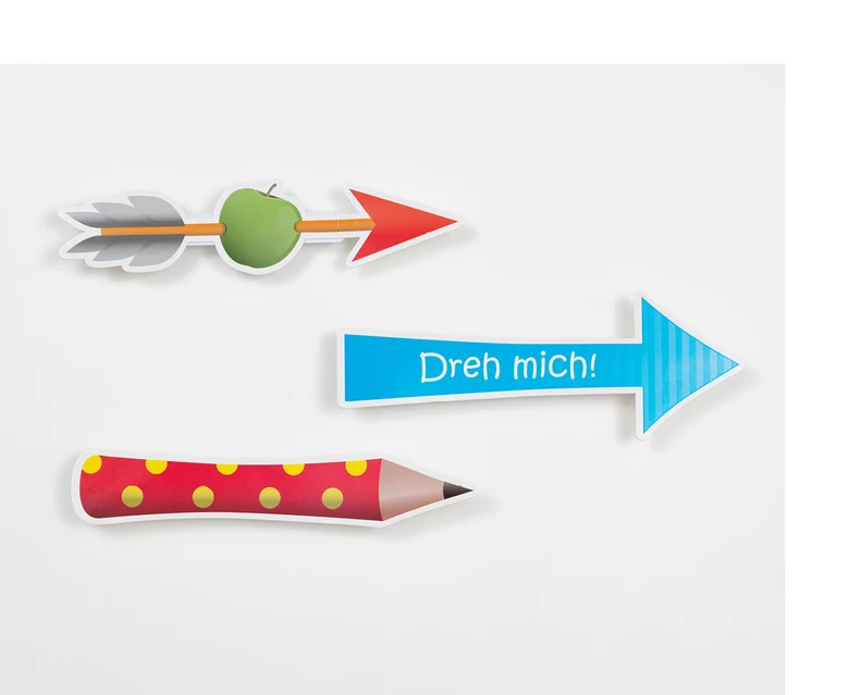 Ein Pfeil, der einen Apfel aufspießt, ein Pfeil, auf dem steht: "Dreh mich!" und ein roter Bundstift mit gelben Punkten zeigen nach rechts.